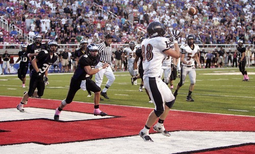 Trent Nelson  |  The Salt Lake Tribune
Herriman's David Christensen pulls in the game-winning pass on a two-point conversion. Herriman vs. Riverton High School football at Rice-Eccles Stadium in Salt Lake City, Utah, Saturday, August 27, 2011.