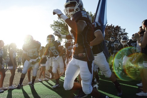 Chris Detrick  |  The Salt Lake Tribune
Layton's J.T. Anderson (2) and his teammates run onto the field during the game at Layton High School Friday August 26, 2011.