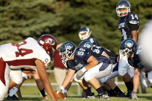 Chris Detrick  |  The Salt Lake Tribune
Layton's Tevita Uasilaa (14) during the game at Layton High School Friday August 26, 2011.