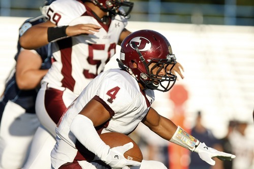 Chris Detrick  |  The Salt Lake Tribune
Jordan's Blake Miller (4) runs the ball during the game at Layton High School Friday August 26, 2011.