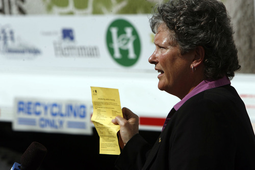 Francisco Kjolseth  |  The Salt Lake Tribune
Salt Lake County Sanitation Director Pam Roberts displays a yellow notice distributed to households to announce the expansion of the county's curbside-recycling program. Instead of picking up recyclables every other week, the county will do it weekly starting Sept. 1.