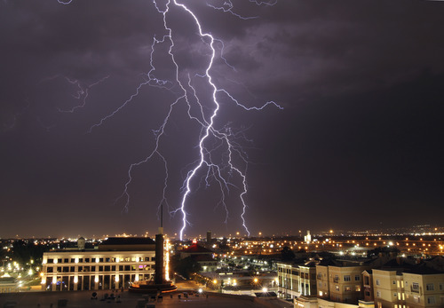 Lennie Mahler  |  The Salt Lake Tribune
A thunderstorm makes its way across the Salt Lake Valley, as seen from The Gateway mall in Salt Lake City on Sunday, Aug. 28, 2011.