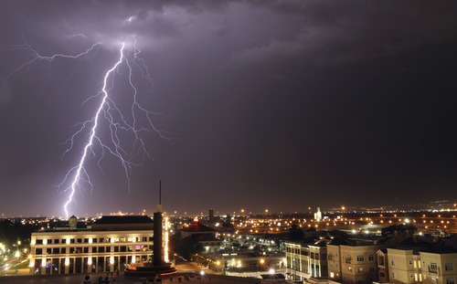 Lennie Mahler  |  The Salt Lake Tribune
A thunderstorm makes its way across the Salt Lake Valley, as seen from The Gateway mall in Salt Lake City on Sunday, Aug. 28, 2011.