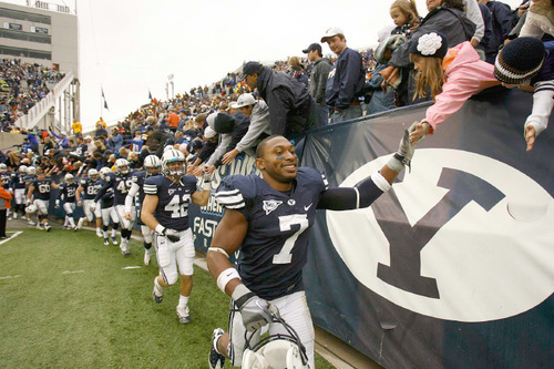 Trent Nelson  |  The Salt Lake Tribune
BYU defensive back Brian Logan (7) high-fives fans after the win, BYU vs. Wyoming, college football Saturday, October 23, 2010 at LaVell Edwards Stadium in Provo. BYU won 25-20.