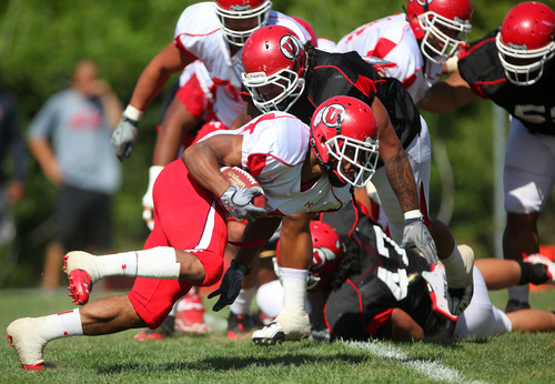 Lennie Mahler  |  The Salt Lake Tribune
Utah running back John White IV rushes the ball during scrimmage Saturday, Aug. 13, 2011, at the Eccles practice field.