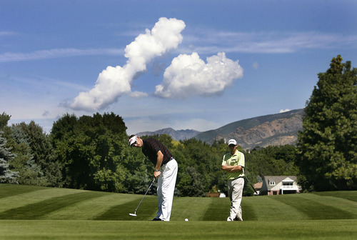 Scott Sommerdorf  |  The Salt Lake Tribune
Clay Ogden, putts on the 3rd green on his way to winning the Utah Open at Oakridge Country Club in Farmington, Sunday, August 28, 2011, with score of 17 under. Behind him to the right is Zenon Brown.