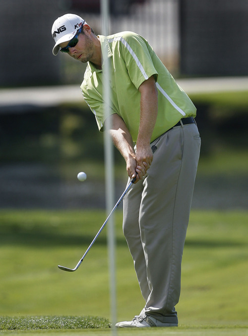 Scott Sommerdorf  |  The Salt Lake Tribune
Zenon Brown of Arvada, CO, chips on 16 during the Utah Open at Oakridge Country Club in Farmington, Sunday, August 28, 2011. Clay Ogden of Farmington won with score of 17 under.