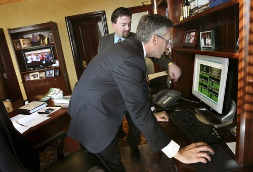 Tribune file photo
Then-
Utah Gov.  Jon Huntsman at the progress of bills with Neil Ashdown, his chief of staff, in this 2008 photo. Ashdown was a top aide to Huntsman when he went to Beijing as U.S. ambassador to China. Ashdown now works on the Huntsman presidential campaign.