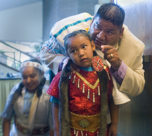 Al Hartmann  |  The Salt Lake Tribune
Jason Walker, chairman of the Northwestern band of Shoshone, gives his daughter Carlise, 6, some encouragment before going out to dance in front of the annual Native American Summit in Salt Lake City on Tuesday.