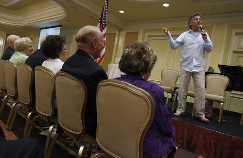 Francisco Kjolseth  |  The Salt Lake Tribune
Entertainer Michael Mclean delights the crowd gathered for the 24th Annual Conference for Seniors, hosted by Senator Orrin and Elaine Hatch gathers at the Little America Hotel in Salt Lake City on Monday, August 29, 2011. The featured keynote address came from James Baker, III, former Chief of Staff to Presidents Reagan and George H. W Bush, and former Secretary of the Treasury and Secretary of State.