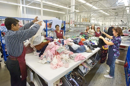 Paul Fraughton  |  The Salt Lake Tribune
Employees and volunteers at the new Deseret Industries location in Sugarhouse sort through  donated clothes Friday,  Aug. 26, 2011.