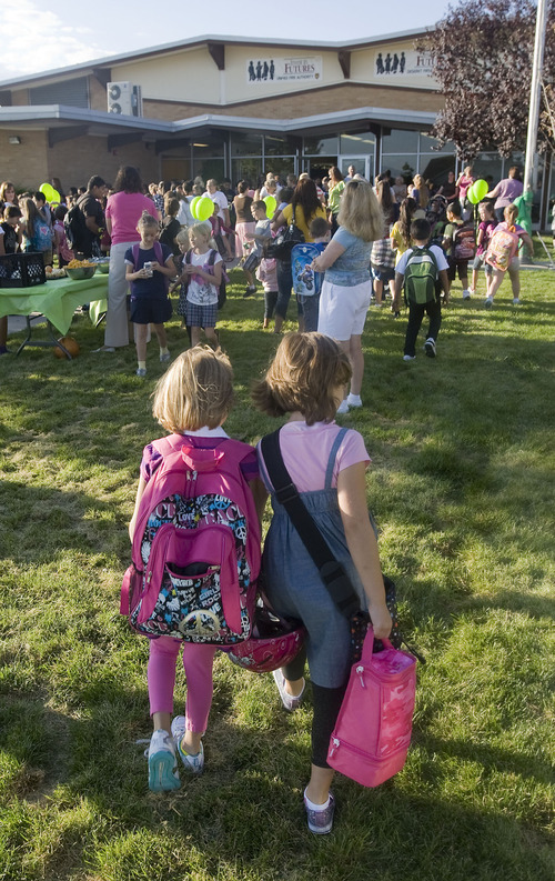 Al Hartmann  |  The Salt Lake Tribune
Friends walk together to Arcadia Elementary at 3461 W. 4850 South in Taylorsville on Wednesday, Aug. 31.   Students, parents, school officials and UDOT kicked off 
