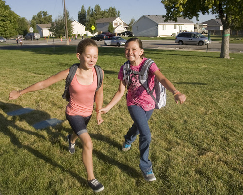 Al Hartmann  |  The Salt Lake Tribune
Sixth-grade friends Sierra Unsworth, left, and Brooklyn Orrillo run hand in hand to the 