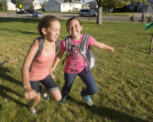 Al Hartmann  |  The Salt Lake Tribune
Sixth-grade friends Sierra Unsworth, left, and Brooklyn Orrillo run hand in hand to the 