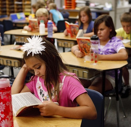 Trent Nelson  |  The Salt Lake Tribune
4th grade students read during class at Lone Peak Elementary in Salt Lake City, Utah, Wednesday, August 31, 2011. Lone Peak made adequate yearly progress this year under the requirements of No Child Left Behind. After test scores in math and language arts fell short last year, the school used frequent assessments to gauge student learning and also hired new classroom aides.