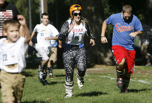 Francisco Kjolseth  |  The Salt Lake Tribune
Kimberly Stephens, center, dressed for speed struggles to stay in the pack during the first ever Yeti Pass Skootch'n Dash  at the Downtown Farmer's on Saturday, September 3, 2011.