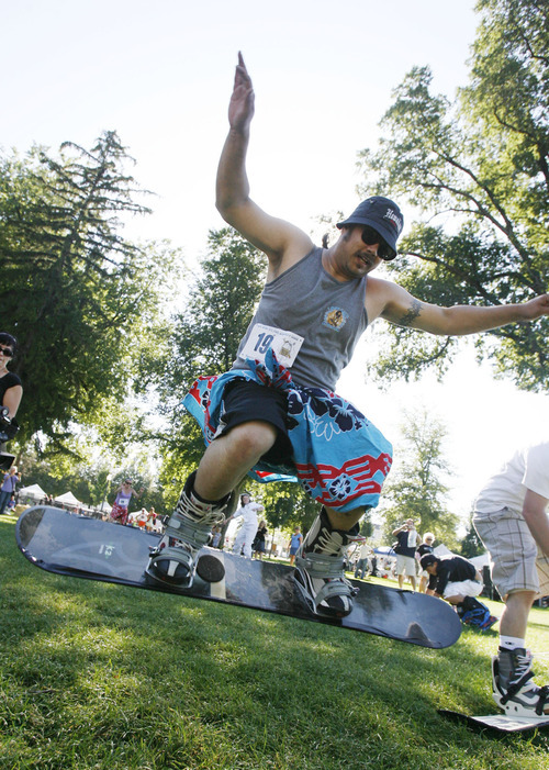 Francisco Kjolseth  |  The Salt Lake Tribune
Chuck Schumaker tries hopping his was to the finish line in the first ever Yeti Pass Skootch'n Dash  at the Downtown Farmer's on Saturday, September 3, 2011.