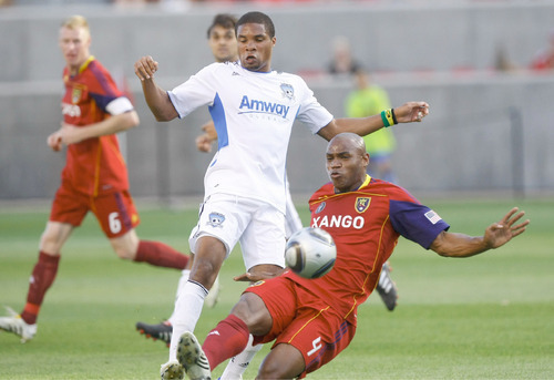 Chris Detrick | The Salt Lake Tribune
Real's Jamison Olave, right, and Earthquakes' Ryan Johnson go for the ball during the first half of the game at Rio Tinto Stadium Friday, June 25, 2010.