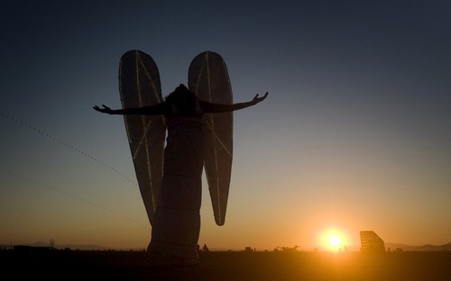 Rick Egan  | The Salt Lake Tribune 

German artist, Mia Florentine Weiss, wears her Art Angel wings at sunrise, Friday, Sept. 2, 2011. Weiss' performance was part of a project called Art Protector.
