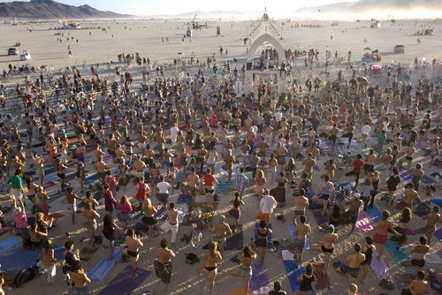 Rick Egan  | The Salt Lake Tribune 

Several hundred of participants join in a yoga class on the playa in front of the the Temple of Transition, at Burning Man Festival Friday, Sept. 2, 2011.