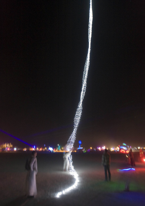 Rick Egan  | The Salt Lake Tribune 

Lights from The Beanstalk glow at the Burning Man Festival, Thursday, Sept. 1, 2011. The Beanstalk consists of Christmas lights hanging from a helium balloon.