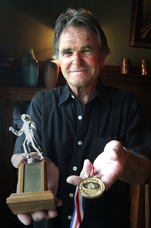 Rick Egan   |  The Salt Lake Tribune
Jack Plumb displays the trophy he won in the national casting competition as a 13-year-old in Chicago, along with the medals for a another national title that he won this summer in Long Beach, Calif.