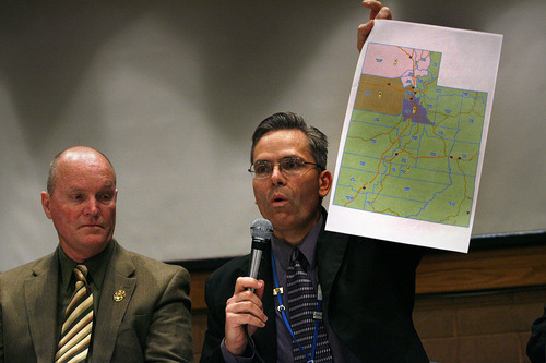 Scott Sommerdorf  |  Tribune File Photo
Chairman Rep. Ken Sumsion, R-American Fork, right, holds up a map of the state of Utah showing district boundaries as Chairman Senator Ralph Okerlund, R-Monroe listens at left. The Legislature's Redistricting Committee is holding hearings throughout the state.