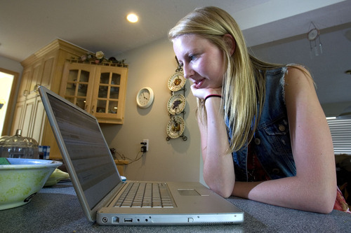 Paul Fraughton  |  The Salt Lake Tribune  
Katelyn Krueger works on a health test online as she sits in her the kitchen of her home. She is enrolled in the first year of The Canyons Virtual High School.