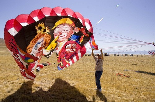 Trent Nelson  |  The Salt Lake Tribune
Ron Bohart launches a clown-themed kite. A variety of large and small kites were flying during the Stampede Festival at Antelope Island on Saturday.