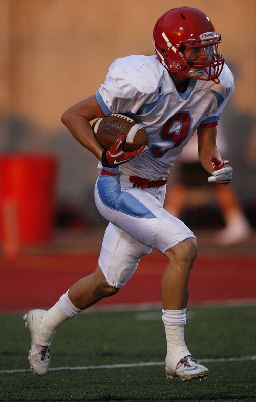Trent Nelson  |  The Salt Lake Tribune
Granger's ach Buchanan runs the ball. Judge vs. Granger High School football in Salt Lake City, Utah, Friday, September 9, 2011.