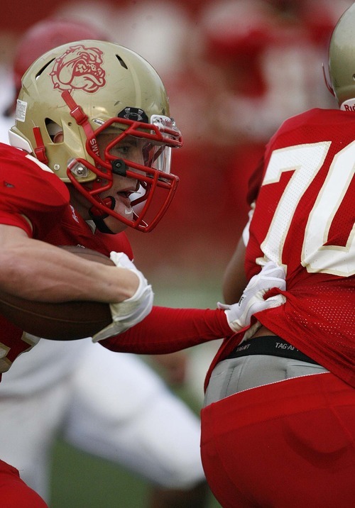 Trent Nelson  |  The Salt Lake Tribune
Judge's Christian Weidle runs the ball, looking for a block from teammate Matt Crispo. Judge vs. Granger High School football in Salt Lake City, Utah, Friday, September 9, 2011.