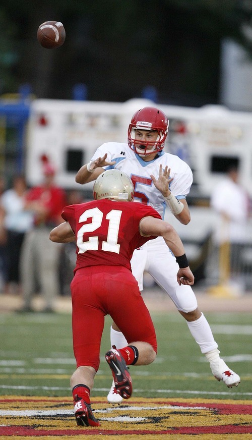 Trent Nelson  |  The Salt Lake Tribune
Granger quarterback Jordan Hernandez throws the ball as Judge defender Pat Neville closes in. Judge vs. Granger High School football in Salt Lake City, Utah, Friday, September 9, 2011.