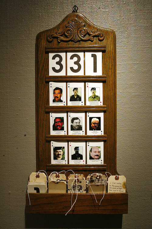 Scott Sommerdorf  |  The Salt Lake Tribune             
A hymnboard with the playing cards of terrorist suspects displayed is part of Frank McEntire's exhibit called 
