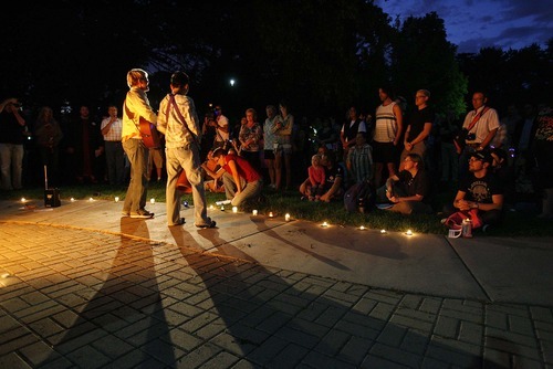 Trent Nelson  |  The Salt Lake Tribune
Mary Tebbs, left, and Leraine Horstmanhoff perform a song on Friday at a fireside vigil at Liberty Park in Salt Lake City. The vigil was in response to three assaults against gay men that have been reported in the past two weeks in Utah.