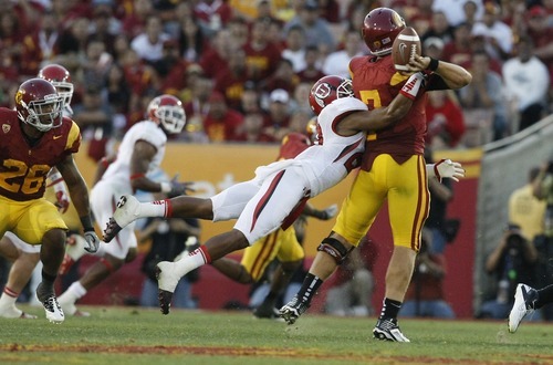 Chris Detrick  |  The Salt Lake Tribune
Utah Utes defensive back Reggie Topps (28) sacks USC Trojans quarterback Matt Barkley (7) during the second half of the game at the Los Angeles Memorial Coliseum Saturday September 10, 2011.