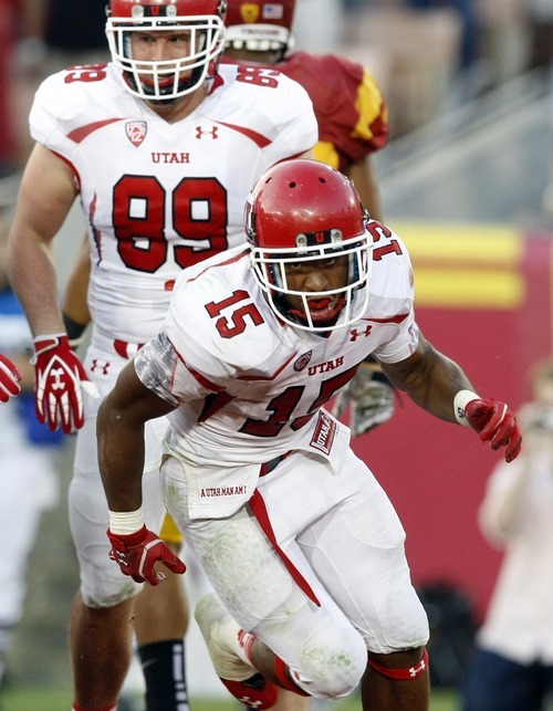 Chris Detrick  |  The Salt Lake Tribune
Utah Utes running back John White IV (15) celebrates after scoring a touchdown during the second half of the game at the Los Angeles Memorial Coliseum Saturday September 10, 2011.