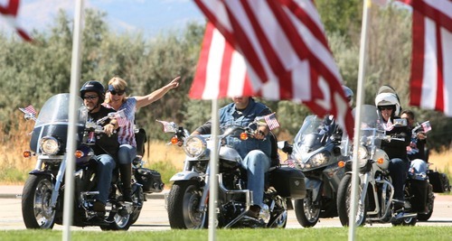 Leah Hogsten  |  The Salt Lake Tribune
Thousands attended Sandy city's Utah Healing Field 9/11 Memorial on the grounds of City Hall to watch the Hope Rising 9/11 bronze monument unveiling  of three NYC firefighters on Saturday in Sandy. The 2011 Fire Ride for motorcyclists commemorated the tenth anniversary of the World Trade Center attacks.