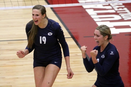 Rick Egan  | The Salt Lake Tribune 

Jennifer Hamson, 19, and Heather Hannemann, 2, celebrate a big score for the Cougars, in volleyball action, Utah vs. BYU, in Salt Lake City, Saturday, September 10, 2011.