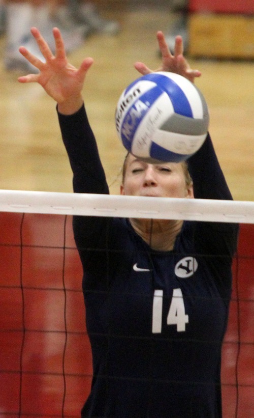 Rick Egan  | The Salt Lake Tribune 

Christie Carpenter, 14, blocks the ball for BYU, in volleyball action, Utah vs. BYU, in Salt Lake City, Saturday, September 10, 2011.