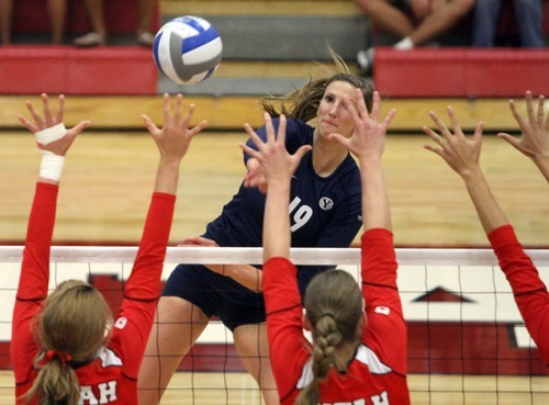 Rick Egan  | The Salt Lake Tribune 

Jennifer Hamson, 19, hits the ball over the net for BYU, in volleyball action, Utah vs. BYU, in Salt Lake City, Saturday, September 10, 2011.