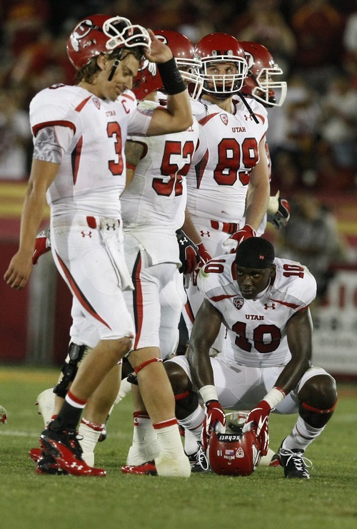 Chris Detrick  |  The Salt Lake Tribune
Utah Utes wide receiver DeVonte Christopher (10) remains on the field as Utah Utes quarterback Jordan Wynn (3) walks by after failing to get a 1st down during the fourth quarter of the game at the Los Angeles Memorial Coliseum Saturday September 10, 2011.