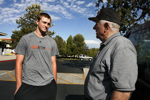 Scott Sommerdorf  |  The Salt Lake Tribune             
Oaks Christian head football coach Bill Redell (right), speaks with his young QB, Luke Falk during a spontaneous meeting in the parking lot at the high school, Sunday, September 4, 2011. The coach stayed longer than he had planned in order to meet breifly with Falk, in order to make sure he wasn't too down after the 31-21 loss to Bellevue (WA) the night before.