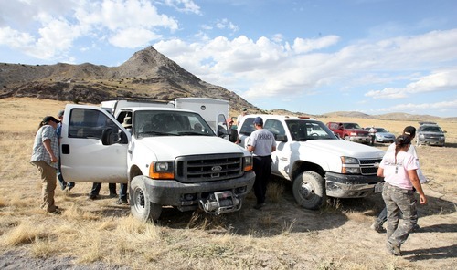 Steve Griffin  |  The Salt Lake Tribune

With Topaz Mountain in the background police officers pack up following a day of searching for the body of Susan Powell near Delta , Utah Tuesday, September 13, 2011.