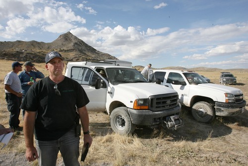 Steve Griffin  |  The Salt Lake Tribune

West Valley City police Lt. Bill Merritt and other police officials pack up following a day of searching for the body of Susan Powell at the base of Topaz Mountain, background, near Delta , Utah Tuesday, September 13, 2011.