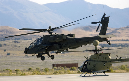 Al Hartmann  |  The Salt Lake Tribune
Aircraft of the Manned-Unmanned System Integration Capability (MUSIC) was demonstrated at Dugway Proving Grounds on Thursday, Sept. 15.  An Apache helicopter, left, takes off followed by a Kiowa during the demonstration.