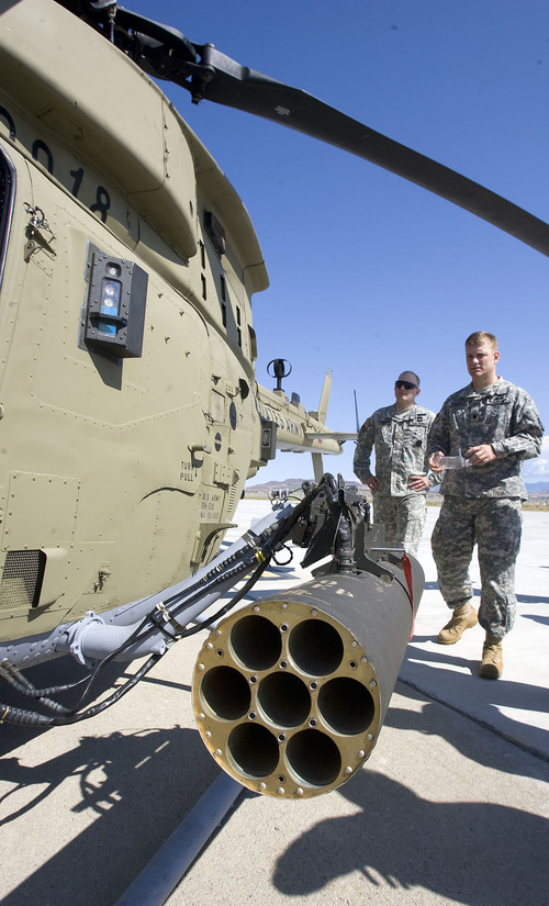 Al Hartmann  |  The Salt Lake Tribune
Aircraft of the Manned-Unmanned System Integration Capability (MUSIC) was demonstrated Thursday at Dugway Proving Ground.    Dugway personnel get a close look at the armaments on the Kiowa helicopter after the demonstration.