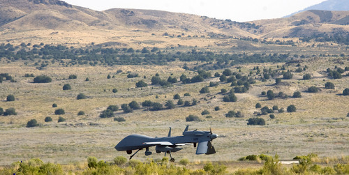Al Hartmann  |  The Salt Lake Tribune
Aircraft of the Manned-Unmanned System Integration Capability (MUSIC) was demonstrated at Dugway Proving Grounds on Thursday, Sept. 15.  An unmanned MQ-1C  Gray Eagle taxis on a landing strip at Dugway before takeoff.