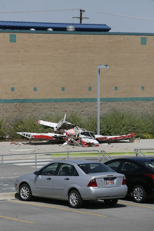 DO NOT RUN
Francisco Kjolseth  |  The Salt Lake Tribune
A small single-engine plane sits next to Columbia Elementary in West Jordan on Thursday, Sept. 15, 2011, after crashing.