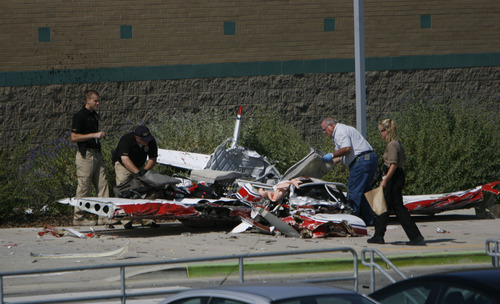 Francisco Kjolseth  |  The Salt Lake Tribune
A small single engine plane sits next to Columbia Elementary in West Jordan on Thursday, September 15, 2011, as investigators work the scene of the single fatal accident shortly after removing the pilot's body.