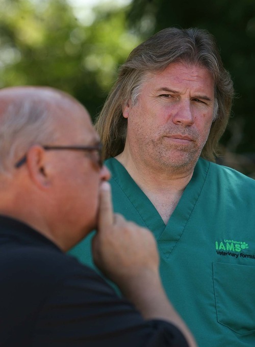 Leah Hogsten  |  The Salt Lake Tribune
Reptile expert Jim Dix (right) and West Valley City Assistant City Manager Paul Isaac (left)  Wednesday, September 7 2011 in West Valley City on abandoned farm acreage leased by Kennecott to determine if the land was suitable for a home for Dix's Reptile Rescue Services, but the location was scrapped due to lack of safe and immediate public access. Dix, one of the few Utahns licensed to handle rattlesnakes, has more than 500 abandoned, seized or injured reptiles and mammals in his care, most of them considered dangerous. He works with shelters, police agencies and animal-control officers statewide to rescue creatures no one else can handle. Dix is being forced from his West Valley home by the Utah Department of Transportation to make way for the Mountain View Corridor transit project.